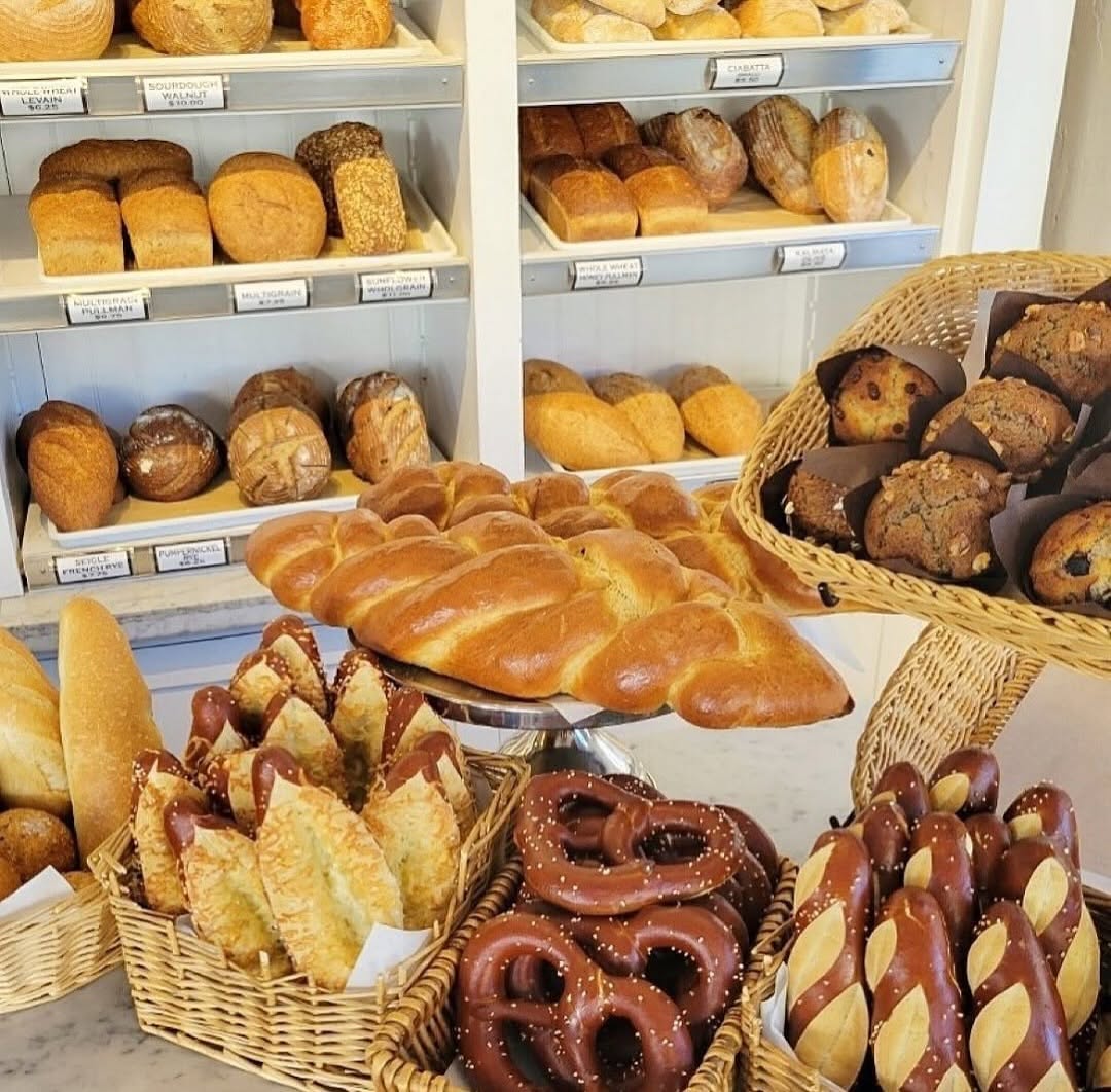 Artisan sourdough loaves cooling in the morning kitchen display