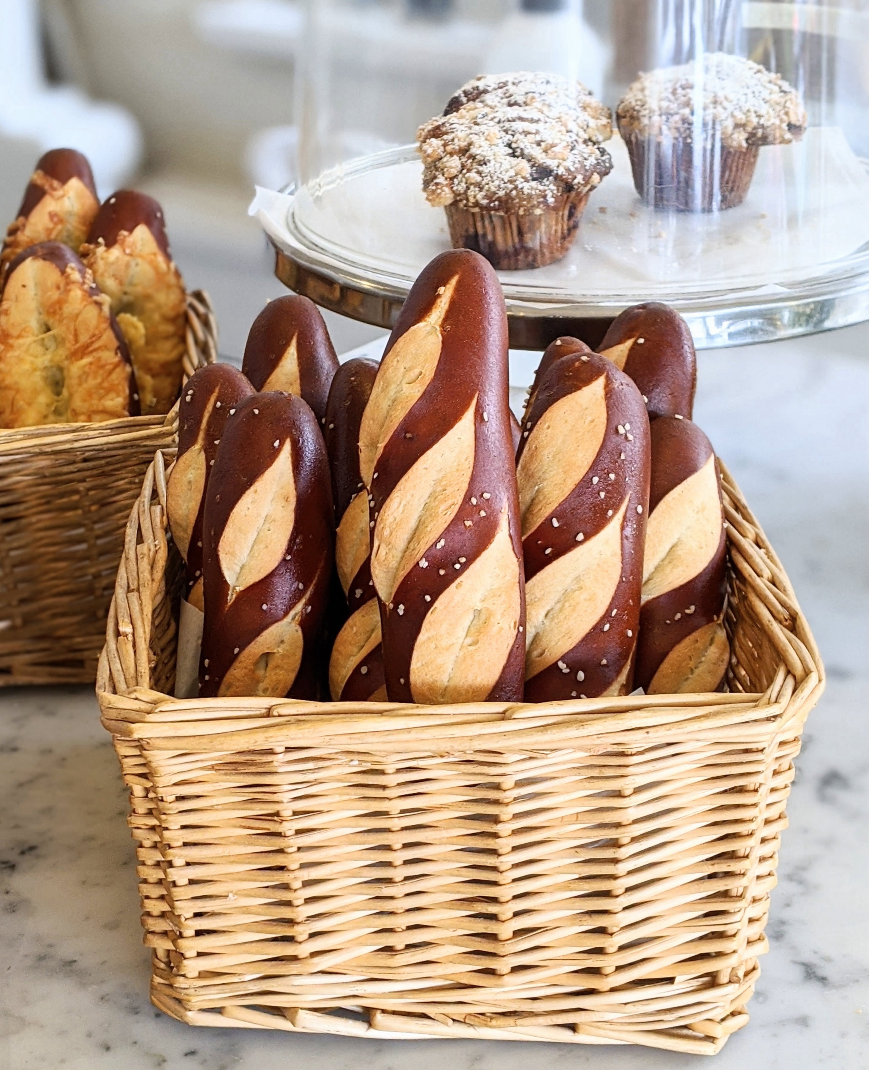 Freshly baked sourdough boules and French baguettes display
