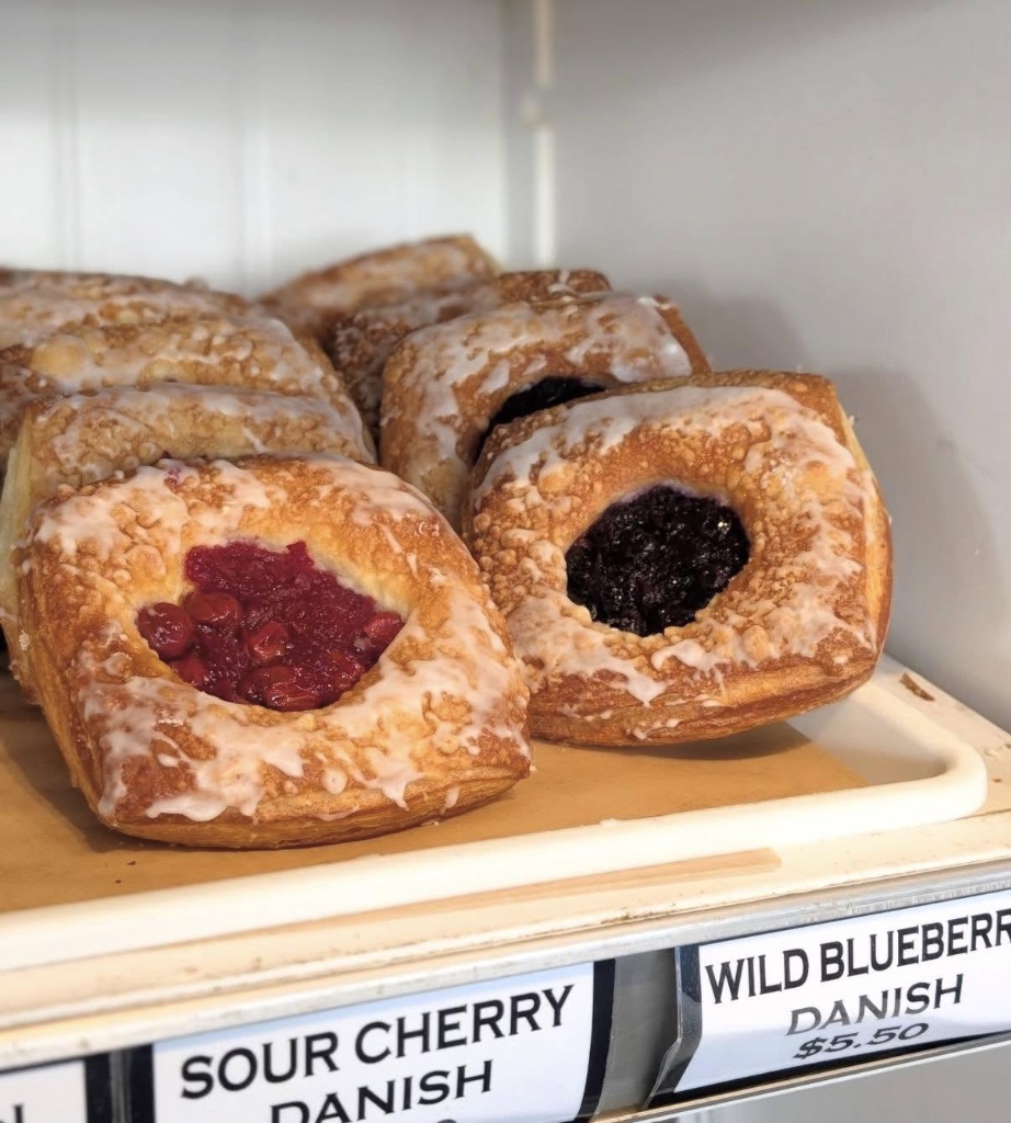 Sour Cherry & Wild Blueberry Danishes in bakery counter display case