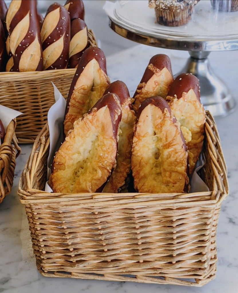Artisan Bavarian pretzel rolls & cheese-crusted pretzel baguettes in counter basket
