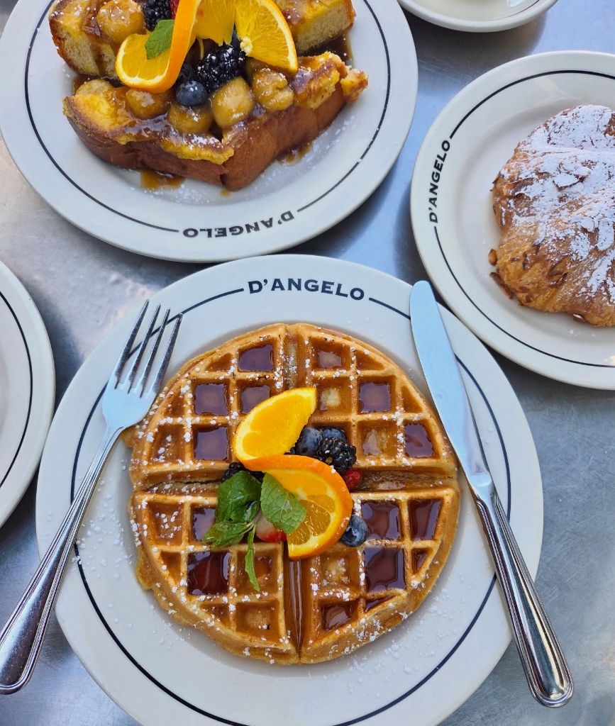 Golden Belgian waffle with berries, citrus, French toast & powdered croissant spread